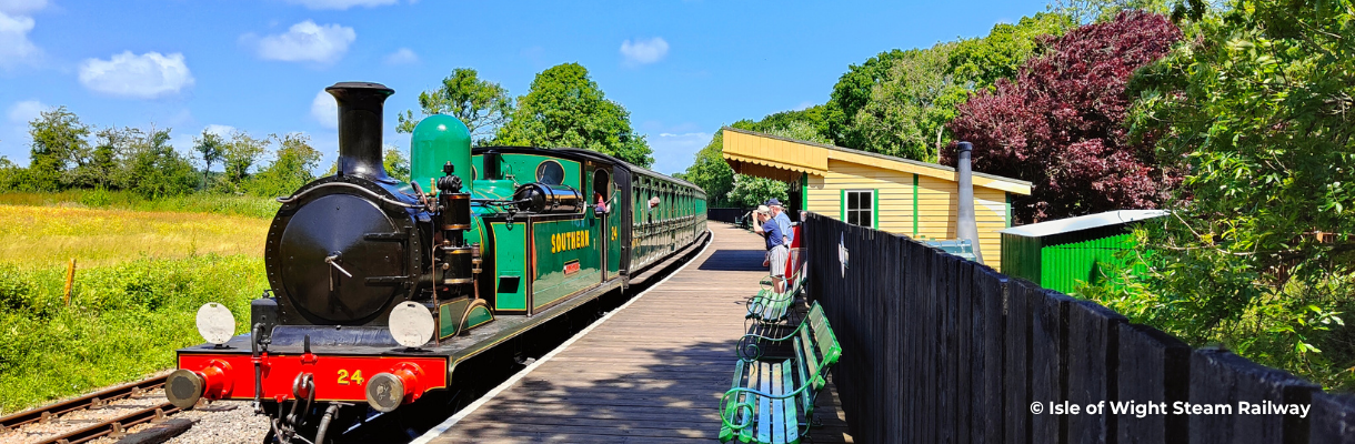 Steam train stationary at train station, Isle of Wight Steam Railway